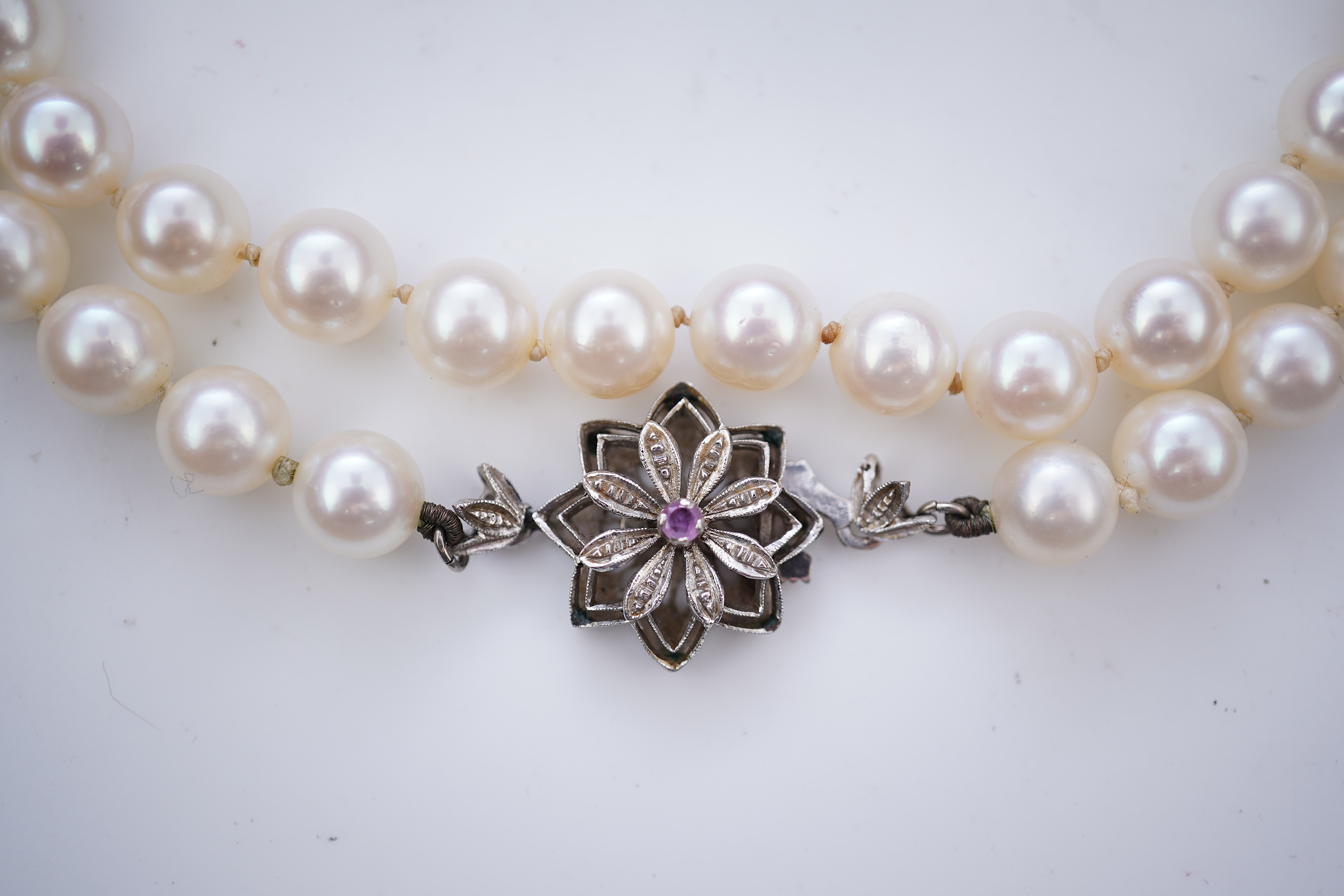 A cultured pearl necklace and pair of mabé cultured pearl ear clips